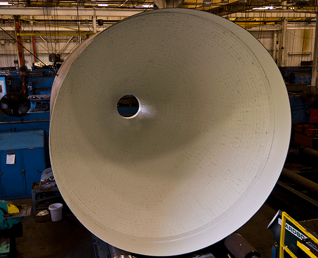 Optional ceramic liners in the cone and spool are preferred for abrasive conditions.