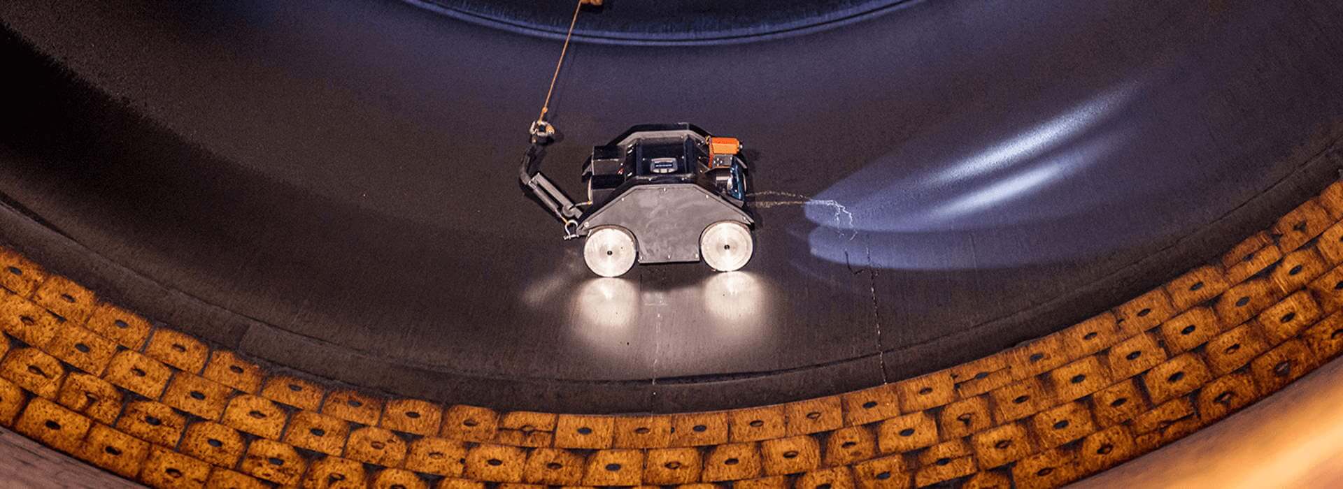 Astec Silobot robot inspecting an asphalt storage silo.