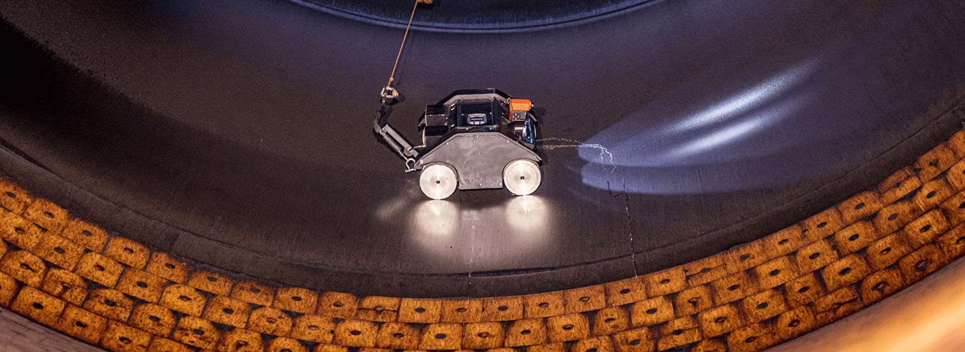 Astec Silobot Astec Silobot robot inspecting an asphalt storage silo.