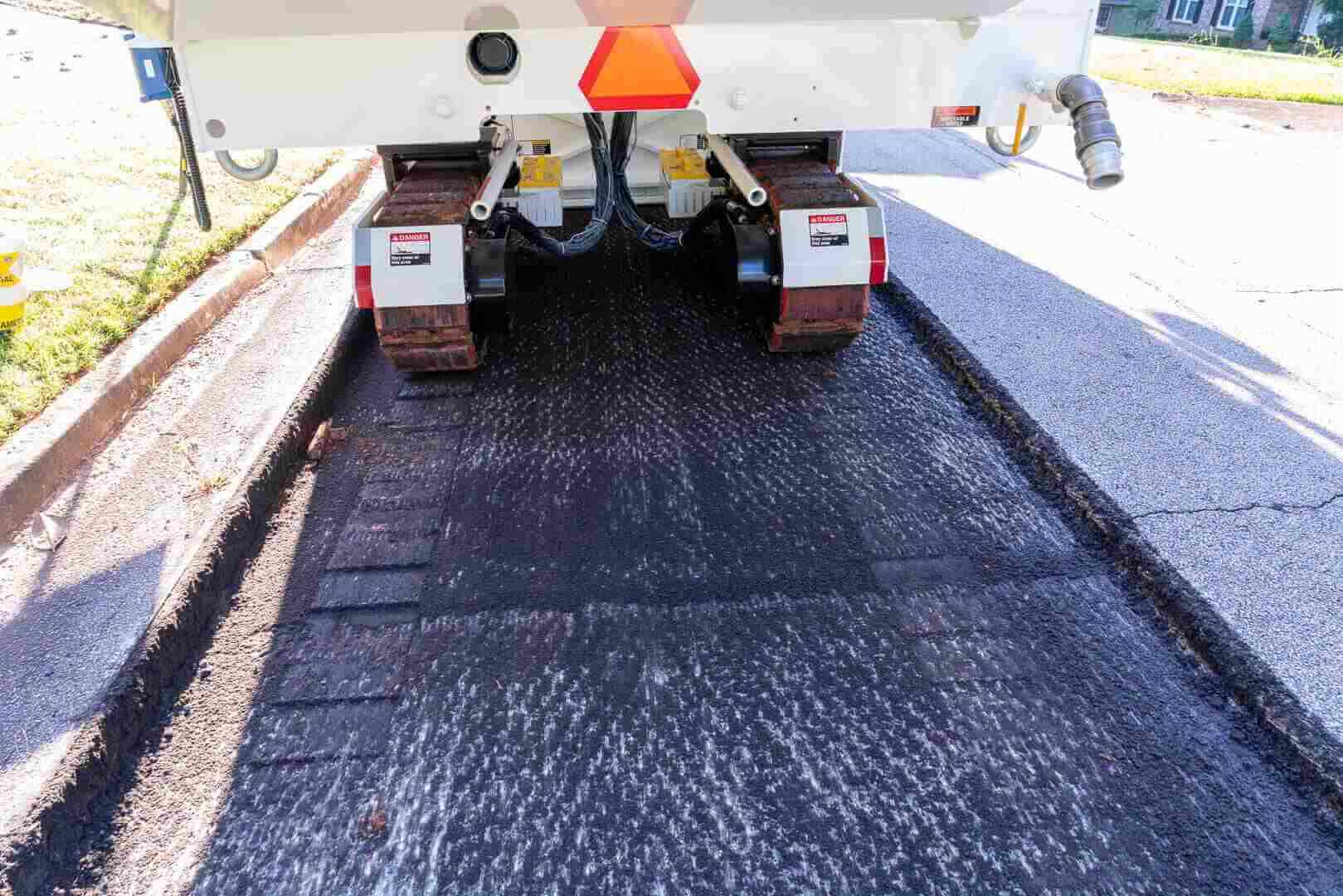 Roadtec RX-600 Cold Planer showing milling asphalt behind cutter